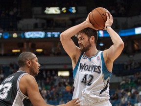 Minnesota Timberwolves forward Kevin Love (42) in action in the first quarter against the San Antonio Spurs forward Boris Diaw (33) at Target Center on Apr 8, 2014 in Minneapolis, MN, USA. (Brad Rempel/USA TODAY Sports)
