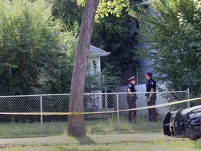 Police investigate an early morning shooting near 97 Street between 111 Avenue and 112 Avenue. (Perry Mah/Edmonton Sun)
