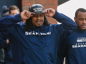 Seattle Seahawks running back Marshawn Lynch adjusts his cap during their NFL Super Bowl XLVIII  walk-through in East Rutherford, New Jersey February 1, 2014. The Seahawks will play against the Denver Broncos in the game on February 2.  (REUTERS)