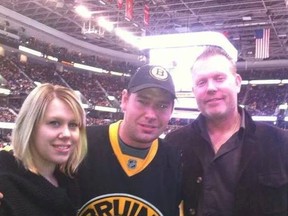 Jonathan Goicoechea, centre, and Daniel Loucks, right, are shown at a recent Boston Bruins game with their sister Crystal. The half-brothers were killed instantly on Sunday, July 27, 2014, when their stopped vehicle was struck by another car.
FACEBOOK PHOTO