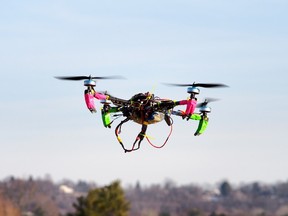 This February 1, 2014 file photo shows a small remote-controlled drone as it hovers in the sky during a meet-up of the DC Area Drone User Group in Middletown, Maryland.  AFP PHOTO / Robert MacPherson