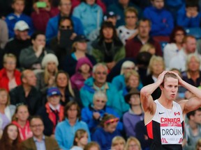 Derek Drouin of Canada reacts as he competes on his way to a first place finish in the Men's High Jump final at the 2014 Commonwealth Games in Glasgow, Scotland, July 30, 2014. (REUTERS/Suzanne Plunkett)