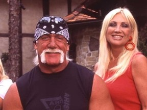 Pro wrestler-actor Hulk Hogan aka Terry Bollea, left, sits with his ex-wife, Linda Bollea outside their house. (QMI Agency Files)