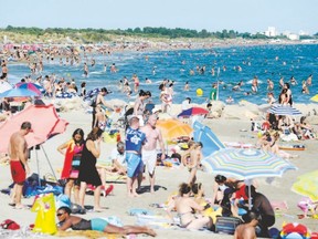 People enjoy the beach in south of France. While French citizens enjoy five weeks of statutory holidays, Canada tops out at 10 days. (Sylvain Thomas/AFP Photo)