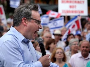 Ezra Levant speaks at a pro-Israel rally at city hall in Calgary, Alta., on Thursday July 31, 2014. Mike Drew/Postmedia