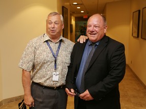 JOHN LAPPA/THE SUDBURY STAR/QMI AGENCYGreater Sudbury city councillor and Sudbury mayoral candidate Ron Dupuis, left, talks with city auditor general Brian Bigger at Tom Davies Square in Sudbury, ON. on Thursday, July 31, 2014.  Bigger was granted a leave of absence following a special meeting of council. Bigger asked for the leave so he could run for mayor of Greater Sudbury in the upcoming municipal election in October.