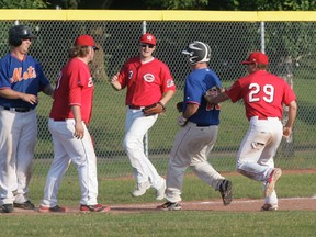 It was a twist on the old Abbott and Costello routine of Who’s on First? for the Stony Plain Mets last week, when they played Who’s on Third? Here, Blair McGough (far left) and  Kevin Geinger end up on the same place at the same time. Geinger was called out on the play but that extra run didn’t matter as the Mets cruised to an 11-0 win over Camrose. - Gord Montgomery, Reporter/Examiner