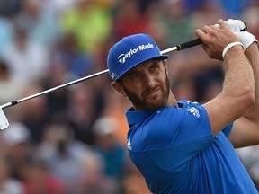 Dustin Johnson of the U.S. watches his tee shot on the fourth hole during the final round of the British Open Championship at the Royal Liverpool Golf Club in Hoylake, northern England July 20, 2014. (REUTERS/Toby Melville)