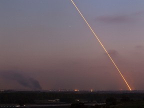 Light streak trail is seen as a rocket is launched from the northern Gaza Strip towards Israel July 29, 2014.  REUTERS/ Amir Cohen