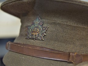 A uniform hat bears the insignia of the 125th Infantry Battalion, Canadian Expeditionary Force and is part of a Great War display at the Canadian Military Heritage Museum in Brantford, Ont. (BRIAN THOMPSON/QMI Agency)