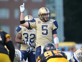Drew Willy signals before the snap during CFL game action against the Hamilton Tiger-Cats on July 31, 2014 at Ron Joyce Stadium in Hamilton.