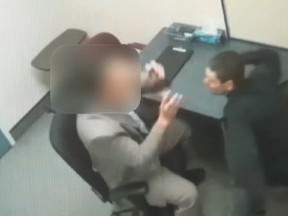 A Quebec City homicide suspect has pleaded guilty to punching a police officer during a videotaped interrogation.
(Screenshot from video)