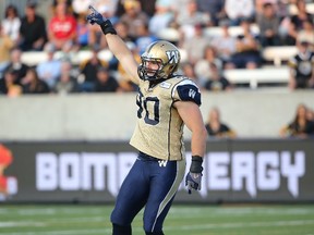 Bomber Greg Peach celebrates a sack during CFL game action against the Hamilton Tiger-Cats on July 31, 2014.