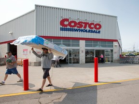 A customer carries a mattress through a set of pillars outside of the Costco store on Wellington Rd. in London this week. Six-year-old Addison Hall died and three members of her family were seriously injured after a car reversed through the front doors of the big-box store last week. A letter writer says Costco could improve traffic flow around its stores by following Ikea?s layout of separate entrances and exits. (CRAIG GLOVER, The London Free Press)