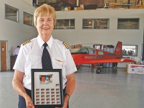 Rosella Bjornson, who grew up on a farm between Champion and Carmangay, was recognized July 13 at the Lethbridge Airport’s Air West Flight School with a commemorative stamp for becoming the first commercially licensed female pilot in Canada.  
Photo courtesy of Grace Klitmoller