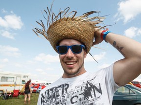 Jesse Paul shows off his upside down inverted sombrero hat in the campground during Big Valley Jamboree 2014 in Camrose, Alta., on Friday, Aug. 1, 2014. The jamboree runs through Aug. 3, 2014. Ian Kucerak/Edmonton Sun/QMI Agency