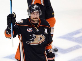 Ducks winger Teemu Selanne salutes the crowd after Game 7 of the second round of the Stanley Cup Playoffs against the Kings in Anaheim on May 16, 2014. The Ducks will retire Selanne's number next season. (Robert Hanashiro/USA TODAY Sports)