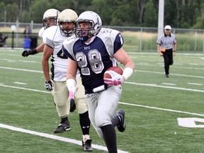 Ben Leeson/The Sudbury Star
Sudbury Spartans running back Josh Cuomo carries the ball down the field during Northern Football Conference action against the Tri-City Outlaws at James Jerome Sports Complex on July 19. The Spartans lost 20-14, but will get another crack at their rivals in Saturday night's playoff opener in Cambridge, Ont. Game time is 7 p.m.