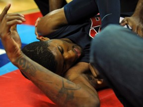 USA Team Blue guard Paul George lays on the floor after injuring his leg during the USA Basketball Showcase at Thomas & Mack Center on August 1, 2014. (Stephen R. Sylvanie/USA TODAY Sports)