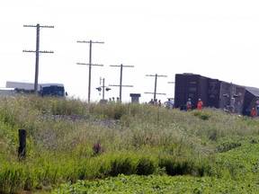 GANANOQUE, ONT. – An passenger bus arrives at the scene of a Via Rail CN freight train collison east of here on Friday afternoon. There were reports of one minor injury in the collision, which forced six freight cars of the track. NICK GARDINER/The Recorder and Times