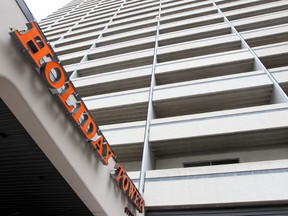 The Holiday Towers at 160 Hargrave Strret in Winnipeg, Man. is seen Monday June 02, 2014. Police have arrested two people in connection with the death of a man inside a suite in the building. (Brian Donogh/Winnipeg Sun/QMI Agency)