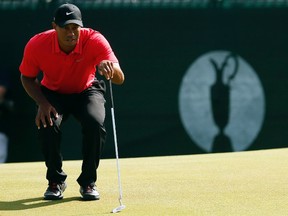 Tiger Woods of the U.S. lines up his putt on the second hole during the final round of the British Open Championship at the Royal Liverpool Golf Club in Hoylake, northern England July 20, 2014. REUTERS/Phil Noble