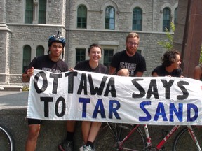 Four cyclists ended their 10-week trek at the Human Rights Monument Saturday, Aug. 2, 2014 protesting the planned Energy East Pipeline, dubbed the Energy East Resistance Ride. L-R: Zed Kronemer, Shannon Burke, Alex Guest, Dyanna Jaye. 
KELLY ROCHE/OTTAWA SUN/QMI AGENCY