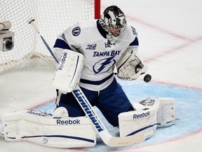 Tampa Bay Lightning goalie Ben Bishop makes a save against Montreal Canadiens during first period NHL hockey action in Montreal, April 18, 2013. REUTERS/Christinne Muschi