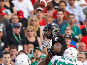 Ottawa RedBlacks WR Marcus Henry can't control a pass as Saskatchewan Roughriders Terrell Maze and Tristan Jackson defend during CFL game action against the at TD Place on Saturday August 2, 2014. 
Errol McGihon/Ottawa Sun/QMI Agency