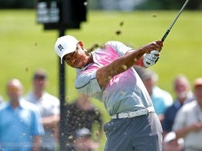 Tiger Woods driving on the seventh hole during the first round of the WGC-Bridgestone Invitational golf tournament at Firestone Country Club - South Course. (Joe Maiorana-USA TODAY Sports)
