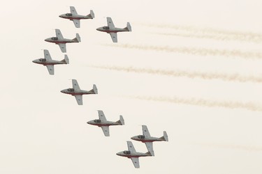 The Royal Canadian Air Force Snowbirds Demonstration Team performs over Big Valley Jamboree 2014 in Camrose, Alta., on Sunday, Aug. 3, 2014. One of the flight's nine aircraft suffered a bird strike at the beginning of the demonstration and landed safely at the Camrose municipal airport. Ian Kucerak/Edmonton Sun/QMI Agency