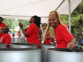 Caribbean Carnival revellers headed to Toronto Centre Island on Sunday. (TERRY DAVIDSON, Toronto Sun)