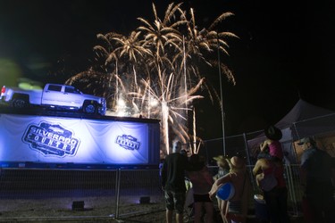 Fireworks explode as concert attendees watch on the final day of Big Valley Jamboree 2014 in Camrose, Alta., on Sunday, Aug. 3, 2014. Ian Kucerak/Edmonton Sun/QMI Agency