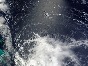 Tropical Storm Bertha passes over the Bahamas in this August 3, 2014 NASA handout satellite photo. Bertha has become the second hurricane of the 2014 Atlantic season, the U.S. National Hurricane Center (NHC) said August 4, 2014. (REUTERS/NASA MODIS Rapid Response Team/Handout via Reuters)