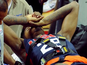 Team USA guard Paul George is carted off the floor on a gurney after suffering a lower leg injury during the USA Basketball Showcase at Thomas & Mack Center. (Stephen R. Sylvanie-USA TODAY Sports)