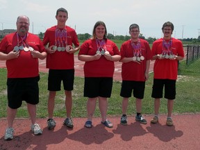 Athletes from Special Olympics St. Thomas hold medals they won at the recent Special Olympics Canada Summer Games: Matt Morrow, left, Jeff Loewen, Tiffany Magdic, Andy Marsh and Gordie Michie. (Contributed photo)