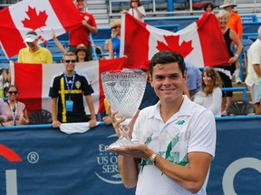 Milos Raonic celebrates with the championship trophy after defeating Vasek Pospisil (not pictured) in the men's singles final on day seven of the Citi Open tennis tournament at the Fitzgerald Tennis Center. Raonic won 6-1, 6-4. (Geoff Burke-USA TODAY Sports)