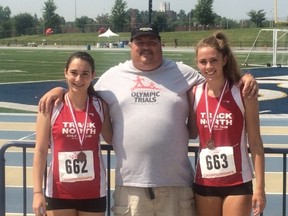 Track North jumping coach Jim Taylor (centre) poses with triple jump gold medallist Jaclyn Groom (right) and Allison Byrnes at the Athletics Ontario Provincial Track and Field Championships, held at the University of Windsor Track and Field Complex on the weekend.
