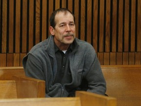 Theodore Wafer sits in the back of the court room before his arraignment in Detroit, Michigan in this file photo taken January 15, 2014, for the November 2, 2013 shooting death of Renisha McBride.  Jury selection was expected to begin on Monday for Wafter, who is charged with killing a black teenager with a shotgun blast to the face after she knocked on his door seeking help early one November morning.  REUTERS/Rebecca Cook/Files