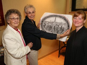 JOHN LAPPA/The Sudbury Star
Ukrainian Seniors' Centre cultural committee members of the 100 year plaque project Mary Stefura, left, and Lydia Katulka, and Stacey Zembrzycki, author of According to Baba, hold a plaque drawing at the centre on Thursday.