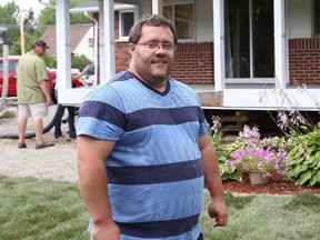 JOHN LAPPA/The Sudbury Star
Kyle Holford, of Lively, is helping out his neighbours, the Nyabeze family, by doing house repairs and landscaping for the family. Neighbours and a number of contractors are volunteering their time and material to help complete the work.