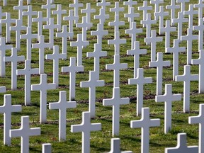 Crosses are seen at the cemetery outside the WWI Douaumont ossuary near Verdun, northeastern France, in this March 30, 2014 file picture. The cemetery is the largest single French military cemetery of the World War One with more than 16,142 graves. Hundreds of thousands of French and Germany soldiers were killed during the battle of Verdun.The fields and woods around Verdun, site of one of the most devastating protracted battles of World War One, may now appear tranquil. But remnants of the war - unexploded ordnance - still pose a threat 100 years on. The 10-month Battle of Verdun ranks among the bloodiest encounters in the Great War, its unrelenting hailstorm of ammunition having killed hundreds of thousands French and German soldiers from February to December 1916. Picture taken March 30, 2014.  REUTERS/Charles Platiau/Files