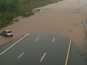 Flood waters on Highway 407 in Burlington Monday, Aug. 4, 2014. (Amy Longley/Special to the Toronto Sun)