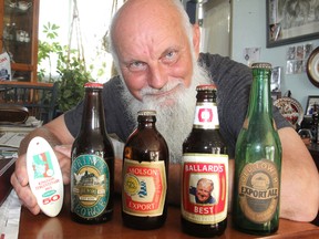 Allan Dodd is president of the Limestone chapter of the Collectors of Canadian Brewery Advertising, which is holding its annual gathering in Kingston next week. Members collect beer memorabilia. MON., JULY 28, 2014 KINGSTON, ONT. MICHAEL LEA\THE WHIG STANDARD\QMI AGENCY