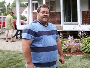 Kyle Holford, of Lively, Ont. is helping out his neighbours, the Nyabeze family, by doing house repairs and landscaping for the family. Neighbours and a number of contractors are volunteering their time and material to help complete the work. (JOHN LAPPA/QMI AGENCY)