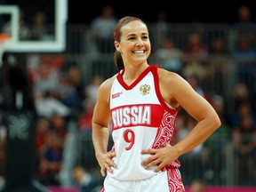 Russia's Becky Hammon smiles toward her bench during the women's preliminary round Group B basketball match. REUTERS/Mike Segar