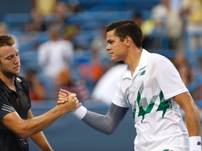 Milos Raonic shakes hands with Jack Sock after their match on day three of the Citi Open tennis tournament at Fitzgerald Tennis Center on July 30, 2014. (Geoff Burke/USA TODAY Sports)