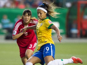 Brazil's Byanca Beatriz Alves De Araujo (9) scores on China during the second half of FIFA U-20 Women's World Cup play at Commonwealth Stadium in Edmonton Alta., on Aug. 5, 2014. Ian Kucerak/Edmonton Sun/ QMI Agency