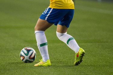 A Brazil player moves the ball across the artificial turf against China during the second half of FIFA U-20 Women's World Cup play at Commonwealth Stadium in Edmonton Alta., on Aug. 5, 2014. Ian Kucerak/Edmonton Sun/ QMI Agency