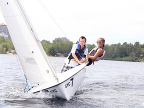 Gino Donato/The Sudbury Star
Eleven-year-old Devin Kuhn learns to sail with the help of volunteer Matilda Hick at the Sudbury Yacht Club sailing school. The club offers sailing lessons for all ages throughout the summer. For more information go to www.syclub.com.